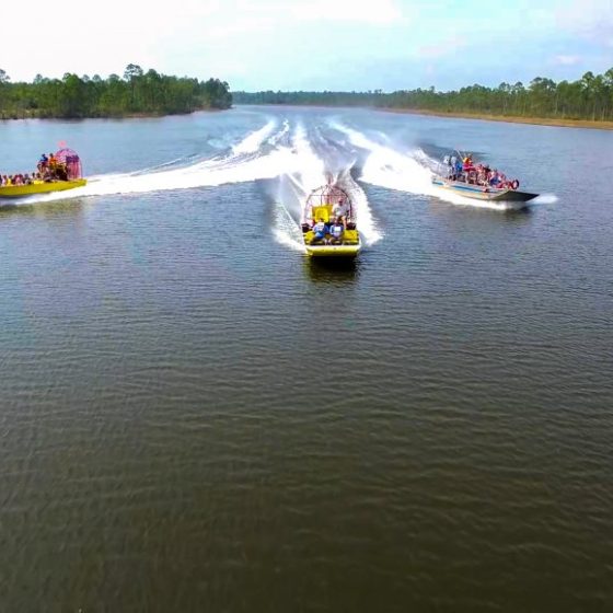 three airboats on the lake