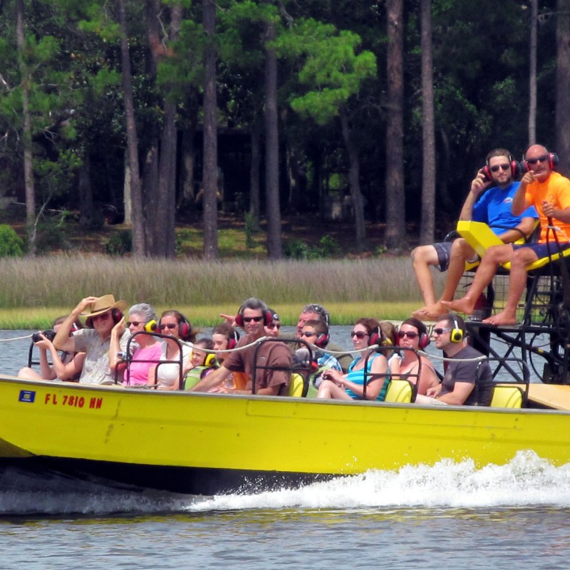 capt mike on the airboat with others
