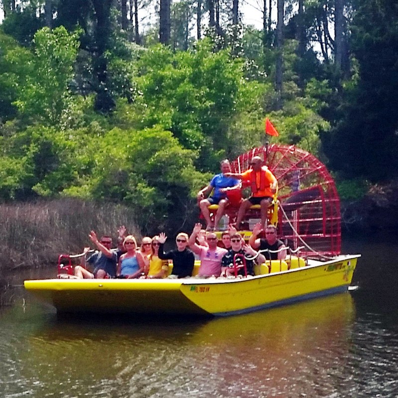 capt mike on the airboat with others
