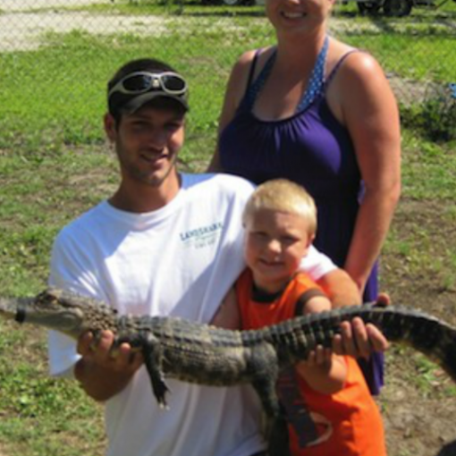 dad and child holding gator
